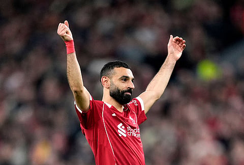 Liverpool's Mohamed Salah celebrates scoring his side's fourth goal  during the second leg of the Champions League round of 16 soccer match between Liverpool and Galatasaray, in Liverpool, England.