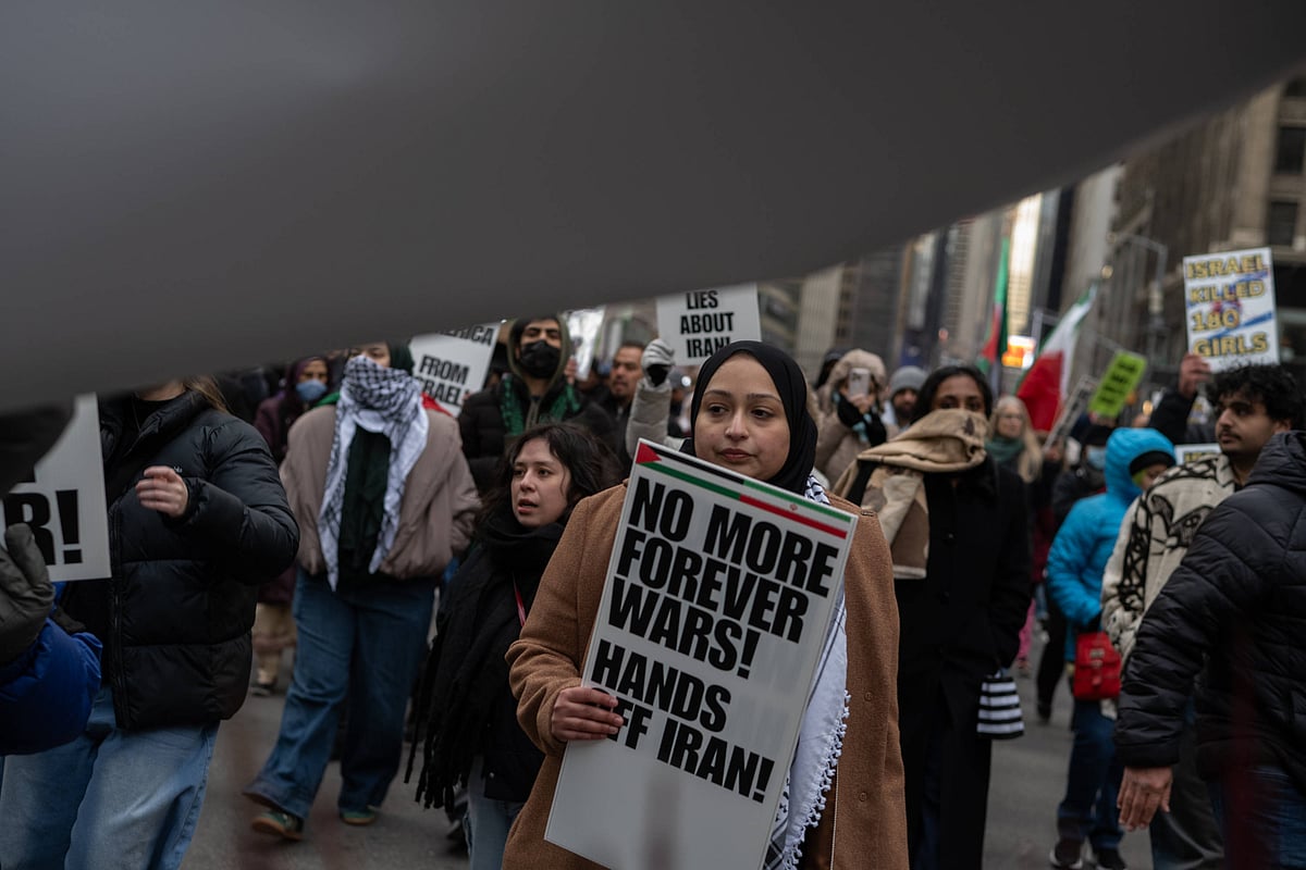 March 13, 2026, New York, New York, USA: A woman carries a sign that reads, "No More Forever Wars! Hands Off Iran!" at an Al Quds Day rally in Times Square marching to Herald Square to mark the last day of Ramadan and to protest the US-Israel war on Iran. - Source: IMAGO / ZUMA Press Wire