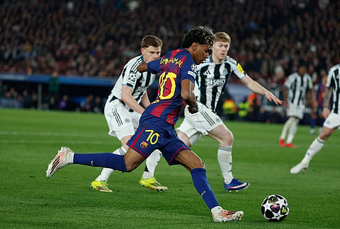 Barcelona's Lamine Yamal controls the ball during the Champions League round of 16, second leg soccer match between FC Barcelona and Newcastle United FC in Barcelona, Spain.