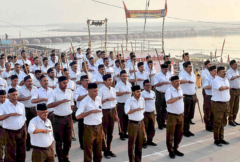 Rashtriya Swayamsevak Sangh (RSS) workers take part in a programme on the first day of the Hindu New Year, in Prayagraj.