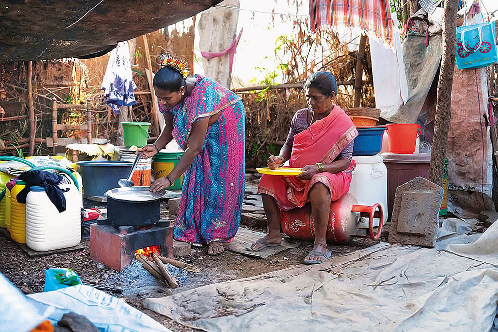 | Photo: Dinesh Parab : Turning to Traditional Ways: Nanu Bai Sohale prepares food on a wood-fired stove in Rajwali village, Vasai, on the outskirts of Mumbai