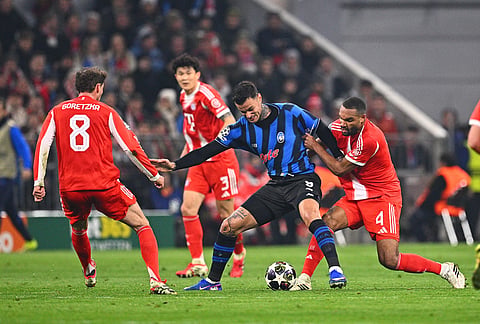 Bayern Munich's Jonathan Tah, right, and Atalanta's Gianluca Scamacca battle for the ball during Champions League round of 16 second leg soccer match between Bayern Munich and Atalanta Bergamo, in Munich, Germany.