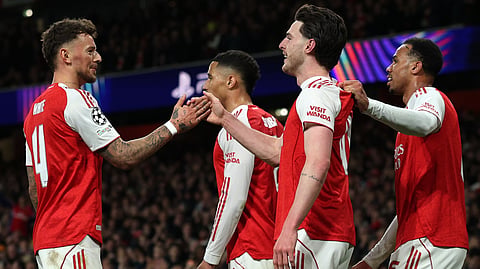 Arsenal's Declan Rice, front, celebrates with teammates after scoring his side's second goal during the second leg of the Champions League round of 16 soccer match between Arsenal and Bayer Leverkusen, in London, Tuesday, March 17, 2026.