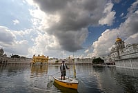 Golden Temple Pilgrims Asked To Remove IDs Carrying Punjab CM Mann’s Photo Amid Video Row | Photo: PTI/Shiva Sharma : Dark clouds hover over the Golden Temple, in Amritsar.