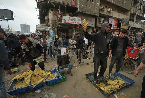 Palestinians shop at a market for Eid al-Fitr celebrations, in Gaza City, Thursday, March 19, 2026. 