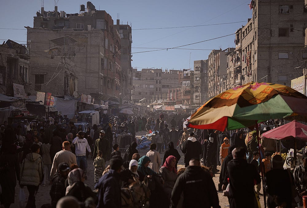 Eid al-Fitr 2026 in Gaza-Palestinians shop at a market 
