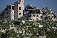 Israel Confirms Killing Of Hamas Armed Wing Chief Izz al-Din al-Haddad In Gaza Strike | Photo: AP/Abdel Kareem Hana : Palestinians visit the graves of their relatives who were killed in the Israel-Hamas war on the first day of the Muslim holiday of Eid al-Fitr in Gaza City, Friday, March 20, 2026.