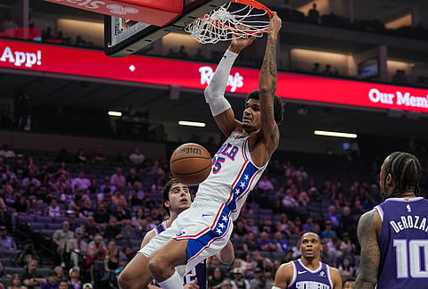 Philadelphia 76ers forward Dominick Barlow dunks the ball during the first half of an NBA basketball game against the Sacramento Kings, in Sacramento, California. 
