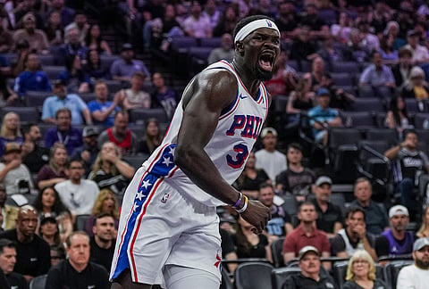 Philadelphia 76ers center Adem Bona (30) reacts after a dunk during the first half of an NBA basketball game against the Sacramento Kings, in Sacramento, California.