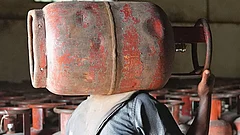 | Photo: Tribhuvan Tiwari : In Short Supply: A man carrying an LPG cylinder at an HP agency in Uttar Pradesh amid the ongoing crisis