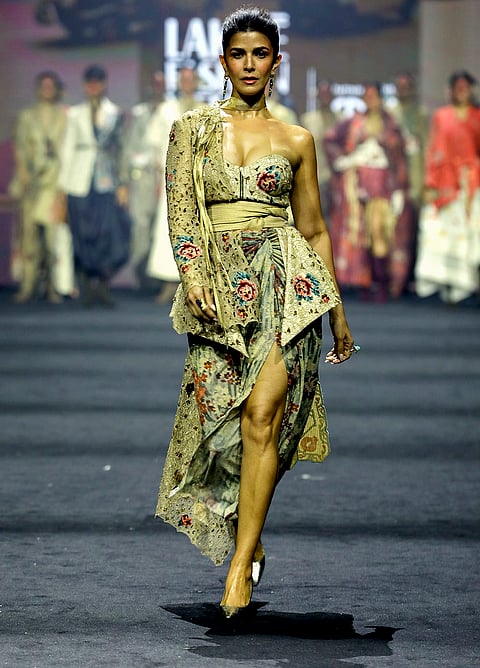 Bollywood actor Nimrat Kaur showcases the creation of designer Jajaabor during the Lakme Fashion Week (LFW), in Mumbai.