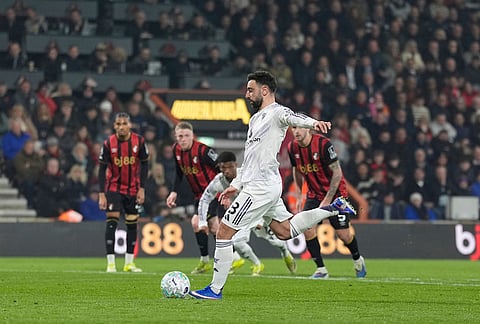 Manchester United's Bruno Fernandes scores during an Premier League soccer match against AFC Bournemouth, in Bournemouth, England. 