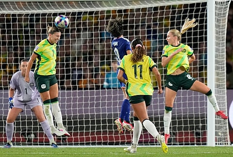 Australia's Steph Catley heads the ball clear during the Women's Asian Cup soccer final between Japan and Australia in Sydney.