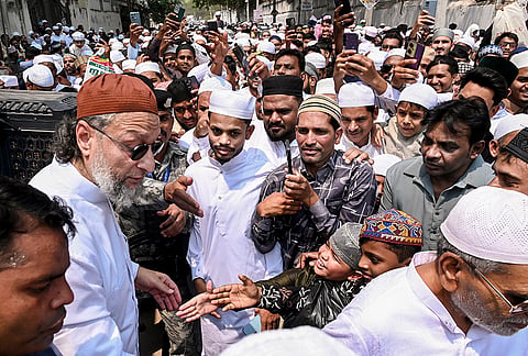 AIMIM chief Asaduddin Owaisi being greeted by people on the ‘Eid al-Fitr’ festival, near Mir Alam Eidgah in Hyderabad.