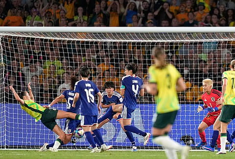 Australia's Caitlin Foord, left, misses a chance during the Women's Asian Cup soccer final between Japan and Australia in Sydney.