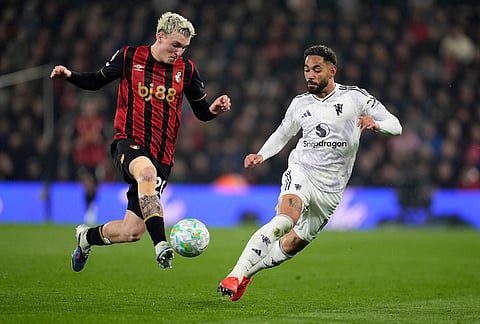 Bournemouth's Alex Jimenez ,left, controls the ball as Manchester United's Matheus Cunha defends during an Premier League soccer match against AFC Bournemouth, in Bournemouth, England.