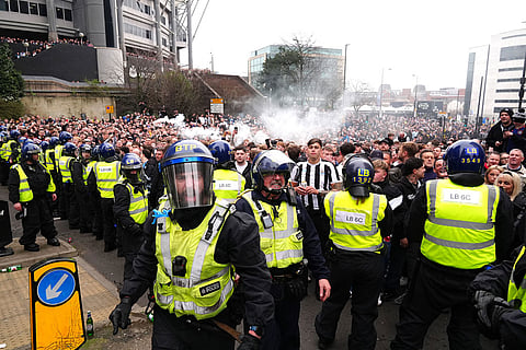 Police separate Newcastle United and Sunderland fans ahead of the Premier League match between Newcastle and Sunderland outside St James' Park, Newcastle upon Tyne, England.