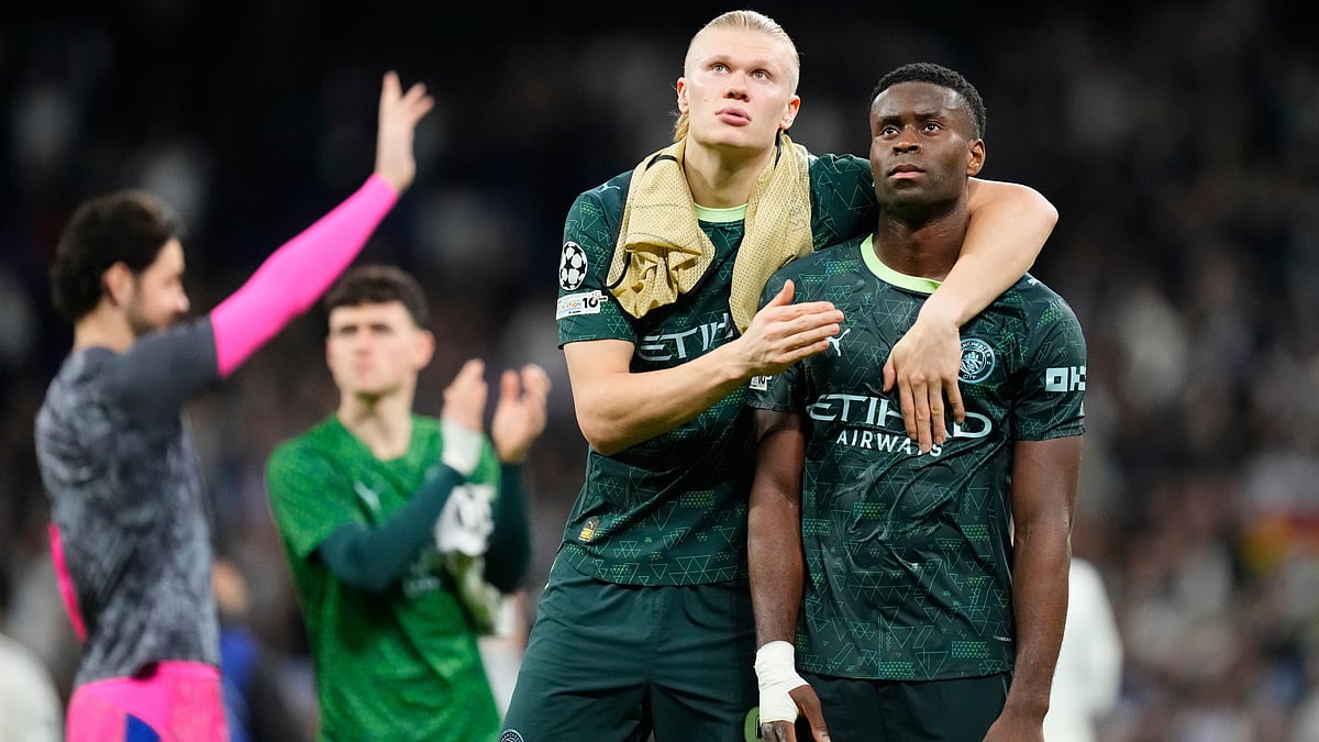 Manchester City's Erling Haaland, left, and Marc Guehi walk off the pitch after a first leg round of 16 Champions League soccer match between Real Madrid and Manchester City in Madrid, Spain, Wednesday, March 11, 2026.  - | Photo: AP/Jose Breton