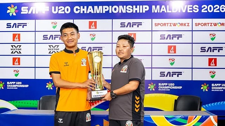 Bhutan U20 captain Rinzin Dorji and head coach Sonam Dhendup with the SAFF U20 Championship trophy. - | Photo: Instagram/saff_football