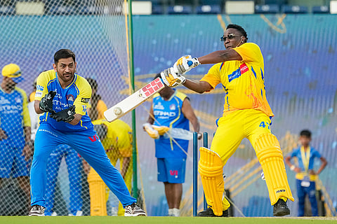 Former cricketer Dwayne Bravo, right, plays a shot during the Chennai Super Kings’ ROAR 2026, pre-season fan event, at M. A. Chidambaram Stadium in Chennai.