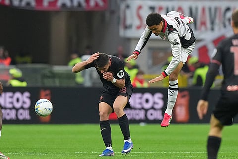 AC Milan's Koni De Winter, right, and Torino's Giovanni Simeone vie for the ball during the Serie A soccer match between AC Milan and Torino, in Milan, Italy.