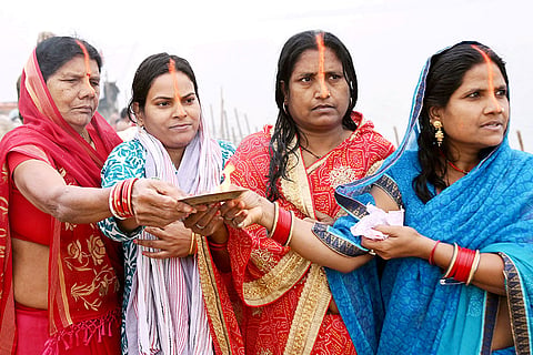 Women perform rituals on the banks of the Ganga marking the start of four-day Chaiti Chhath Puja celebrations with Nahay-Khay, in Patna.