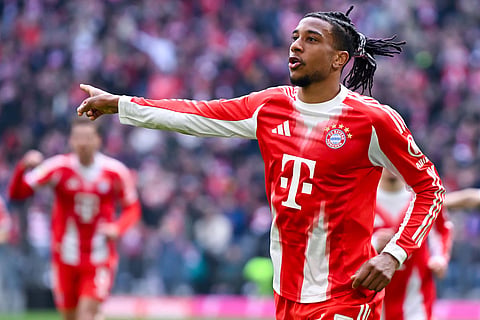 Munich's Michael Olise celebrates after scoring the opening goal during the German Bundesliga soccer match between FC Bayern Munich and 1. FC Union Berlin in Munich, Germany.