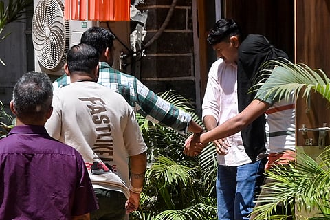 Accused Golu Pandit is escorted by Mumbai Police personnel to a sessions court in a firing case, in Mumbai.