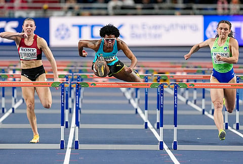 From left to right, Ida Beiter Bomme, of Denmark, Devynne Charlton, of Bahamas, and Nika Glojnaric, of Slovenia, compete in a women's 60 meters hurdles semifinal at the World Athletics Indoor Championships in Torun, Poland.