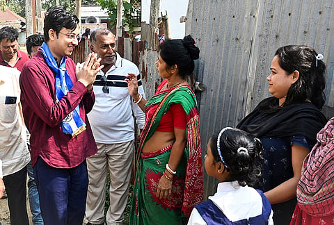 TMC candidate from Gazole constituency, Prosenjit Das, left, campaigns for the West Bengal Assembly elections, in Malda.