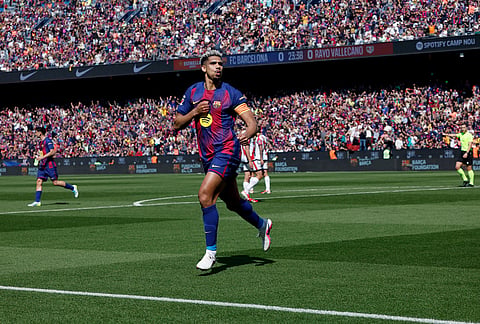 Barcelona's Ronald Araujo celebrates after scoring during a La Liga soccer match between Barcelona and Rayo Vallecano in Barcelona, Spain.