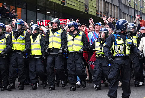 Police surround Sunderland fans ahead of the Premier League match between Newcastle and Sunderland outside St James' Park, Newcastle upon Tyne, England.