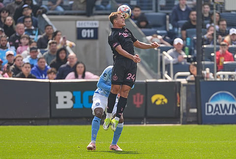 Inter Miami's Mateo Silvetti, top, takes a header in from of New York City FC's Tayvon Gray during the first half of an MLS soccer game at Yankee Stadium in New York.