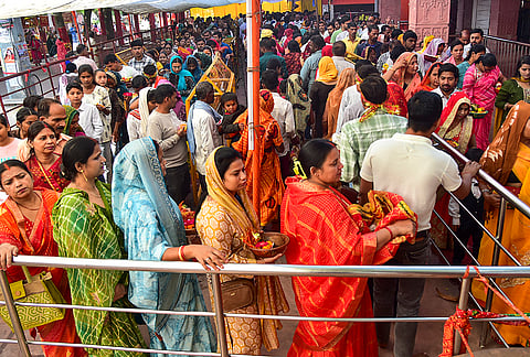 Devotees wait in a queue before offering prayers during the ‘Navaratri’ festival, Alopi Shankari Devi Shakti Peeth Temple in Prayagraj.