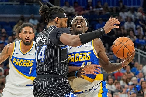 Indiana Pacers forward Pascal Siakam, right, drives against Orlando Magic center Wendell Carter Jr.during the second half of an NBA basketball game in Orlando, Fla.