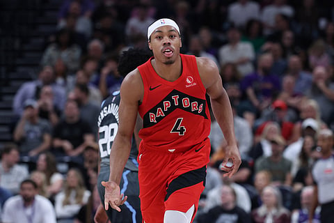 Toronto Raptors forward Scottie Barnes reacts after making a basket at the buzzer to end the first half of an NBA basketball game against the Utah Jazz in Salt Lake City.