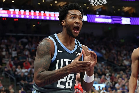 Utah Jazz forward Brice Sensabaugh reacts after a play against the Toronto Raptors during the first half of an NBA basketball game in Salt Lake City.