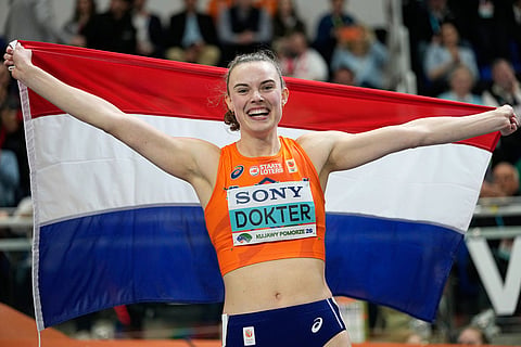 Sofie Dokter, of the Netherlands, celebrates after winning the gold medal in the pentathlon at the World Athletics Indoor Championships in Torun, Poland.