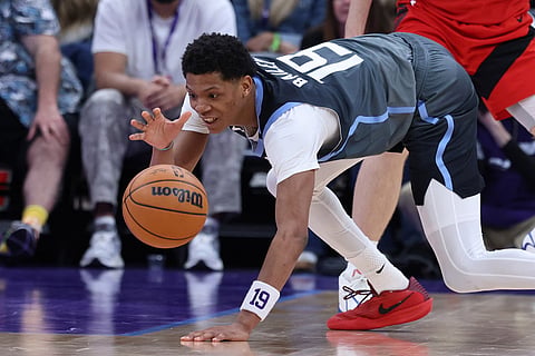 Utah Jazz guard Ace Bailey reaches for the ball during the second half of an NBA basketball game against the Toronto Raptors in Salt Lake City.