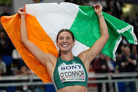 Kate O'Connor, of Ireland, celebrates after winning the bronze medal in the pentathlon at the World Athletics Indoor Championships in Torun, Poland.