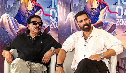 Bollywood actor Akshay Kumar, right, during promotions for his upcoming film "Bhoot Bangla", in Mumbai. Akshay says "Dhurandhar" is a great film that appeals to adults while his upcoming film "Bhoot Bangla" is for both children and families. 