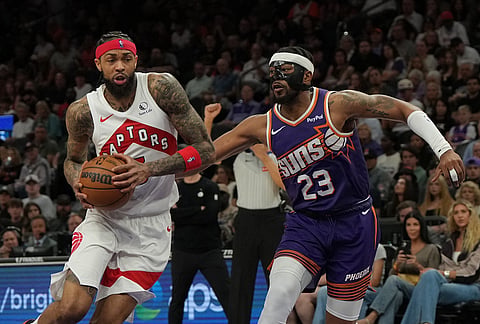 Toronto Raptors forward Brandon Ingram drives on Phoenix Suns guard Jordan Goodwin (23) during the second half of an NBA basketball game in Phoenix. 