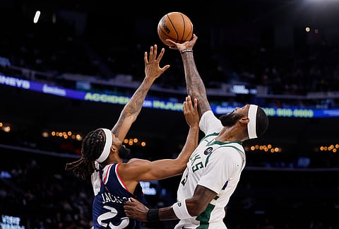 Milwaukee Bucks forward Bobby Portis (9) reaches for the ball while being guarded by LA Clippers forward Isaiah Jackson (23) during the first half of an NBA basketball game in Inglewood, California. 