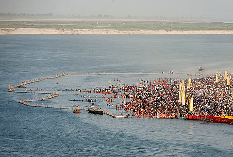 People take a holy dip in the Ganga river during ‘Chaiti Chhath’ festival, in Patna.