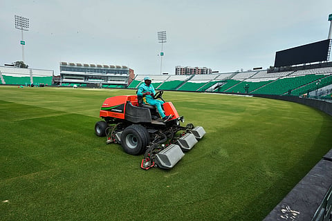 A groundsman works at the at the Gaddafi Stadium in preparations for upcoming Pakistan's premier domestic T20 the Pakistan Super League, which will take place in empty stadiums due to the recent spike in oil prices, in Lahore, Pakistan.