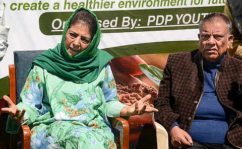 People’s Democratic Party (PDP) Chief Mehbooba Mufti, left, addresses a press conference, in Srinagar.