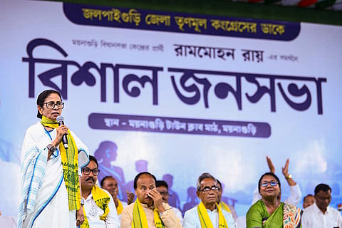In this image posted on March 25, 2026, West Bengal Chief Minister Mamata Banerjee addresses a public rally in support of candidate Ram Mohan Roy from Maynaguri Assembly constituency ahead of state assembly elections, in Jalpaiguri district.