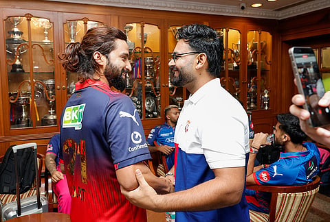 Indian Premier League team captains Rajat Patidar (Royal Challengers Bengaluru) and Rishabh Pant (Lucknow Super Giants) interact in Mumbai with other skippers in the background, ahead of the meeting with the Board of Control for Cricket in India.