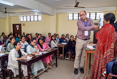 Polling officials undergo training on the operation of Electronic Voting Machines (EVM) and VVPAT units ahead of the Assam Assembly elections, in Guwahati.