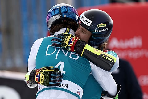 Brazil's Lucas Pinheiro Braathen, back to camera, is congratulated by Norway's Henrik Kristoffersen after winning an alpine ski, men's giant slalom discipline title, at the Lillehammer World Cup Finals, in Hafjell, Norway.